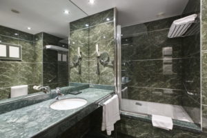 Luxury bathroom in green marble. Decoraton hotel home interior. Horizontal